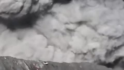 Tourists running for their lives during volcano eruption in Indonesia.