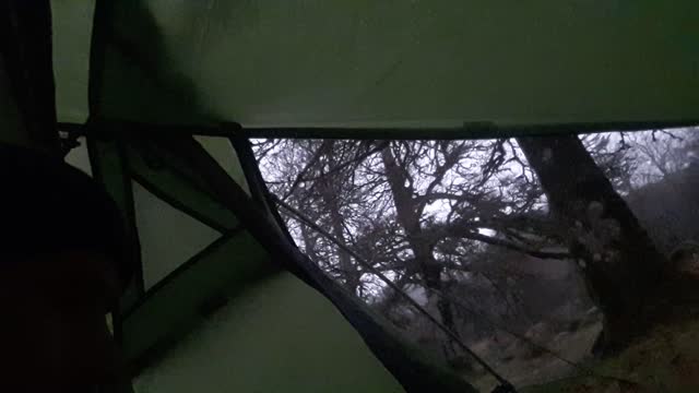 Inside the Bnshe 300. Hail outside. Riverside wildcamping.