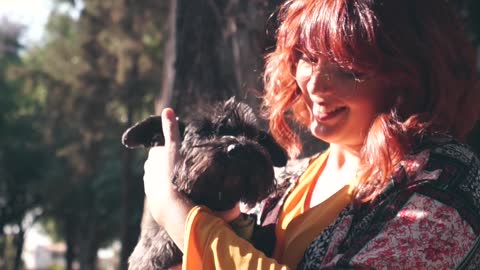 A Woman Petting Her Dog