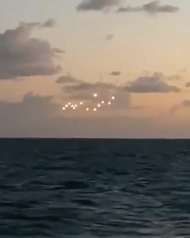 MIDDLE OF THE OCEAN FLEET OF UFOs ANGELS CHARIOTS OF GOD HOVER ILLUMINATED BRIGHTLY🕎 Isaiah 13:3