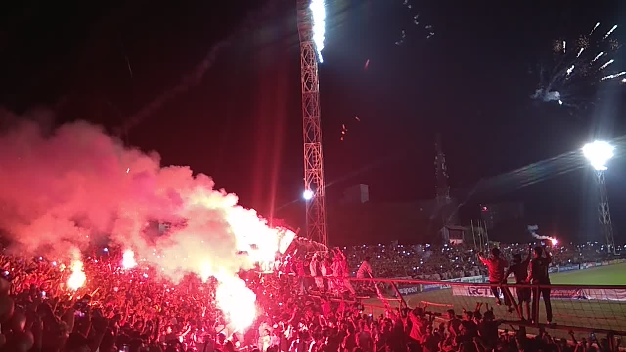 Indonesian Soccer Supporters Celebrate The Trophy Winning With Fireworks and Flares