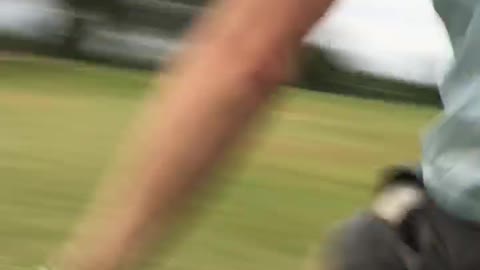 Guy running into golf cart and falling