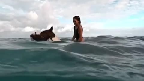 Riding a horse in the middle of the sea