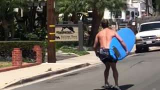 Man skating with blue surf board