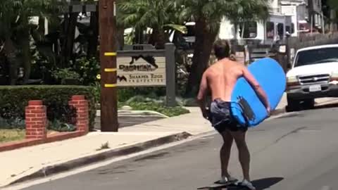 Man skating with blue surf board