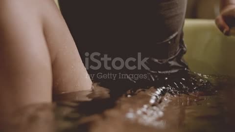 Depressed Young Woman Lowering Herself Into Bath stock video