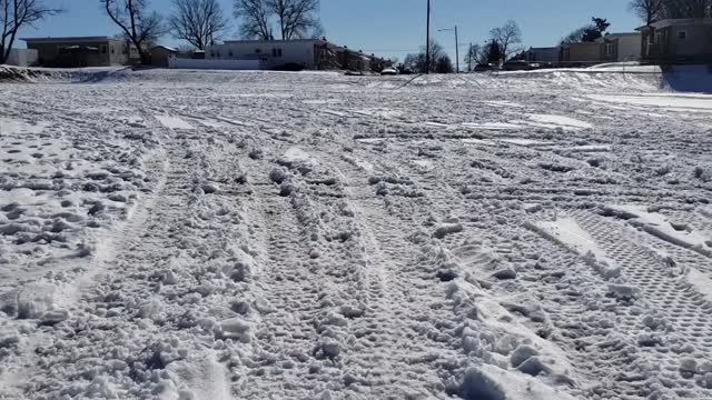 Residents drive across ball field to and from home