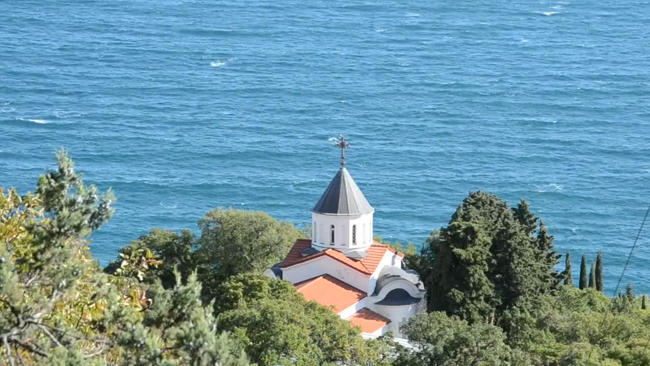 Dome of a church near the sea, from afar