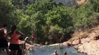 Group of people at river man falls