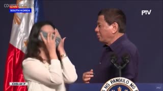 Duterte kissing woman