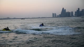 High speed water bike racing with water spray