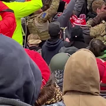 Donald Trump supporters pulling Antifa terrorists away from building.