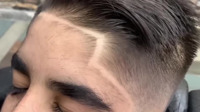 Boy with long lashes gets a little trim!