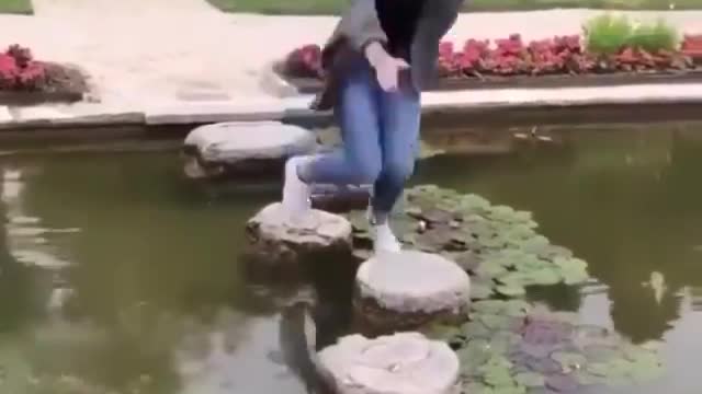 Girl's hilarious attempt to run over stepping stones