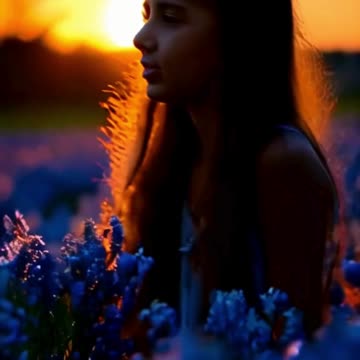 girl in blue flower field