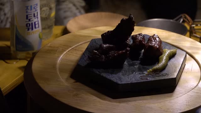 Grilled beef plated on the camping ground. 3