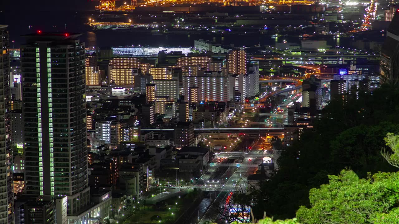 Illuminated city with fast traffic at night
