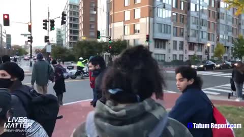 Whose streets? 2 young guys marched away from the main DC gathering. The way the guy talks to police