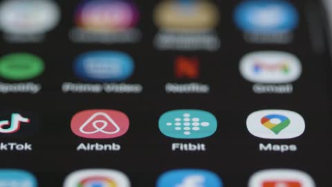 Close Up Orbiting of Fitbit App on Phone