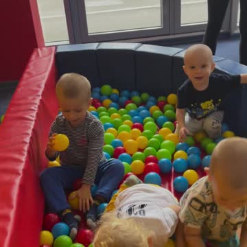 Kids are playing with colorful balls