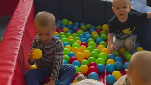 Kids are playing with colorful balls