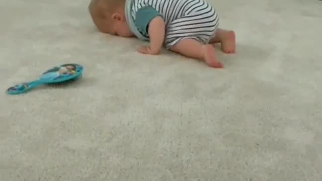 How is a small child playing on the floor?