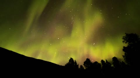 Beautiful northern lights of yellow and pink tones