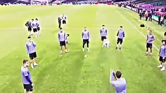 Real Madrid players warm up on the pitch