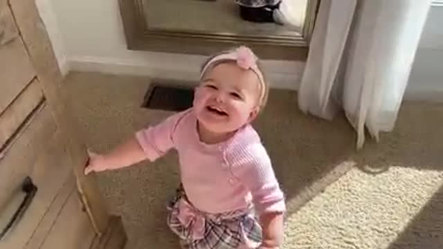 adorable baby girl first steps