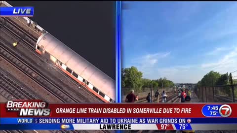 Smoke was seen coming from front of an Orange Line train over the Mystic River this morning.