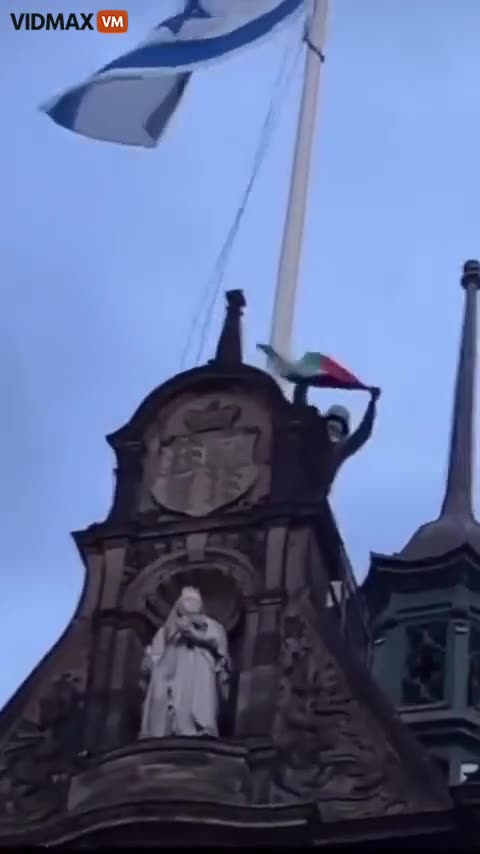 Hamas Supporter Scales UK Sheffield Town Hall To Remove The Israeli Flag, Replacing With Palestinian