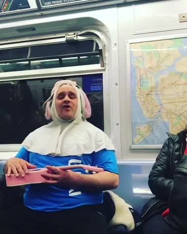 Blue shirt pink guitar guy elephant hat subway