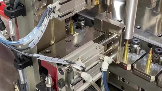 5.56 being loaded. Part of How ammo is made.