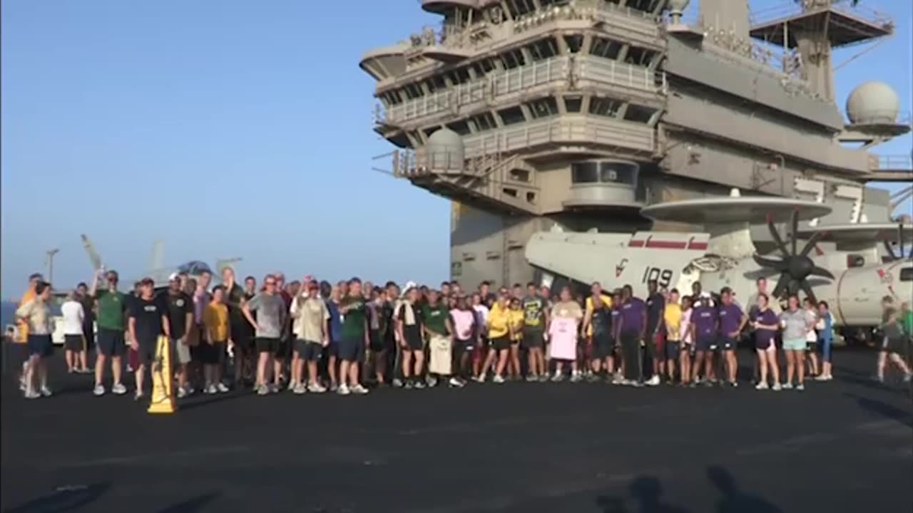 Sailors aboard USS George H W Bush send best wishes to marathon runners