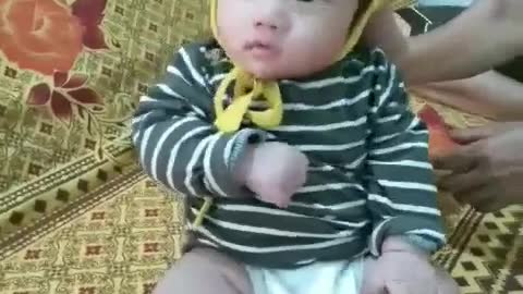 2-month-old boy practicing to sit