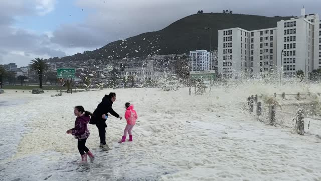 Cape Town Storm Brings Waves of Seafoam onto Shore