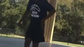 Guy plays basketball and tries to do a layup, slips and falls