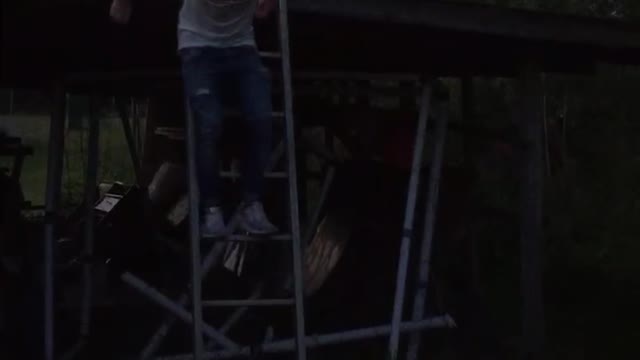 White shirt guy jumps off ladder and breaks foldable table