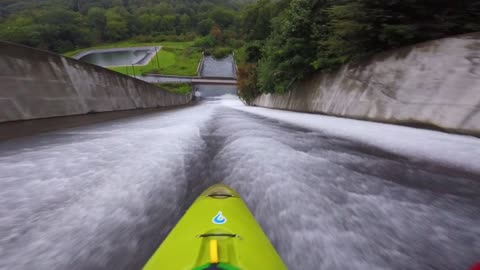 Kayaker Paddles Down Slide