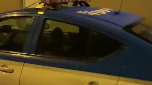 man thinks he is the valentao and climbs on top of the police vehicle in rio de janeiro brazil