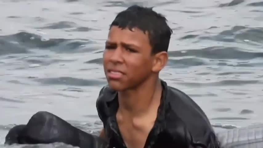 young migrant with plastic bottles tied to her body