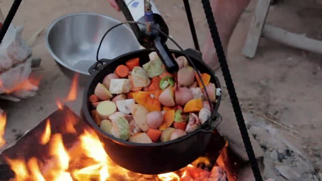 Pouring wine into a cooking pot