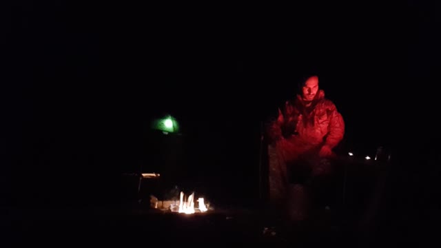 Campfire test footage. Illuminated tent in the background