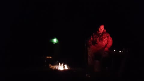 Campfire test footage. Illuminated tent in the background
