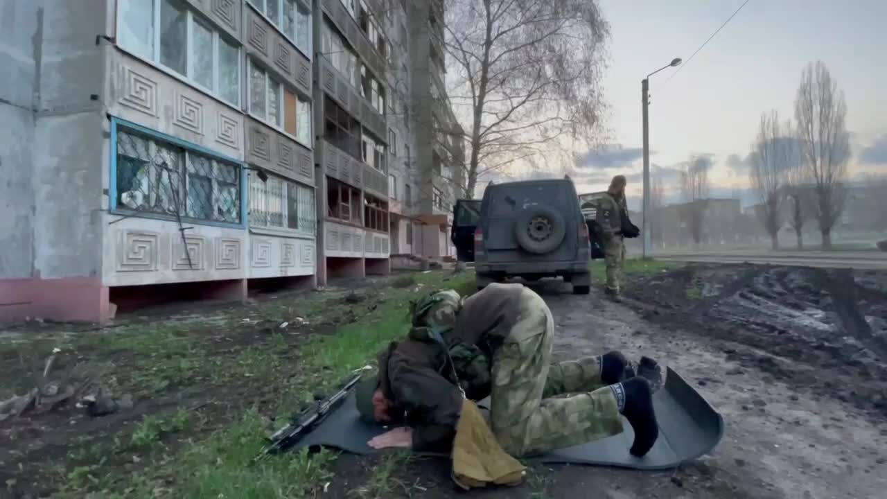 Soldier from the Chechen Republic prays between battles in Mariupol.