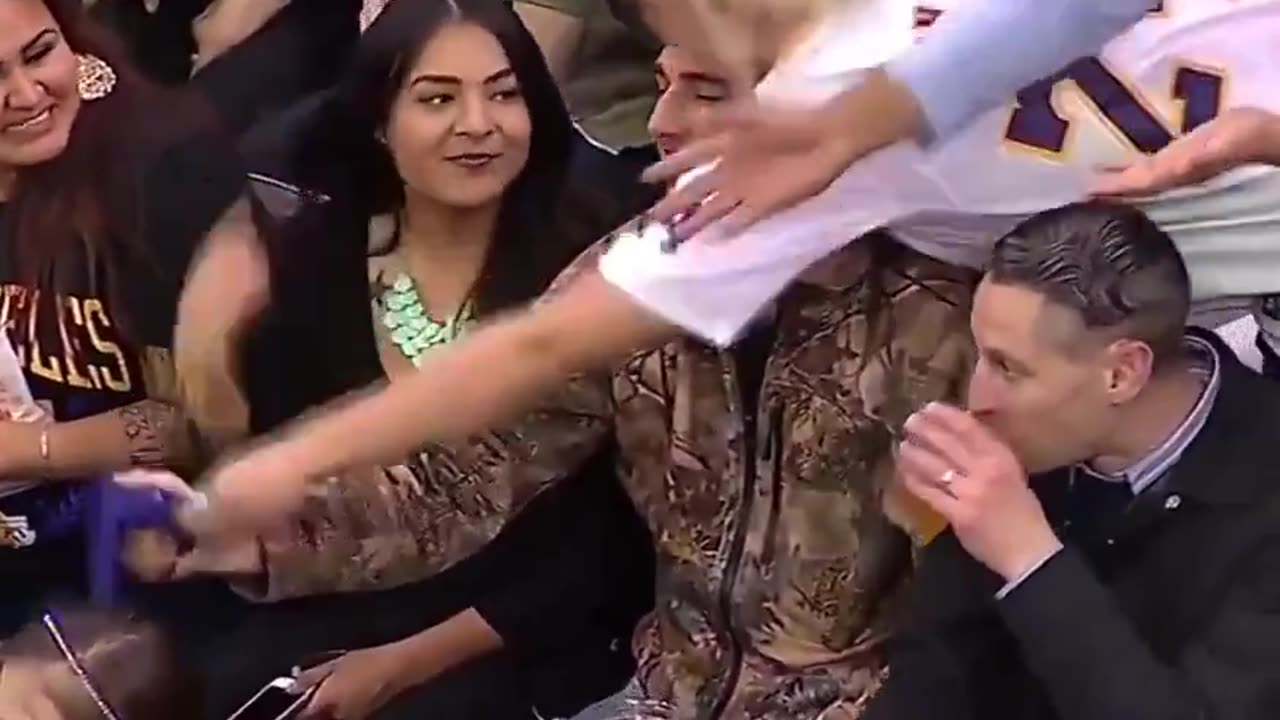 Kobe gives his arm sleeve to a fan, then other fans steal it 😬