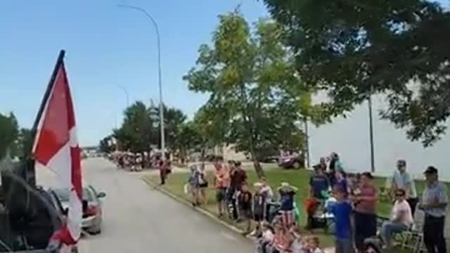 Winkler Manitoba massive weekend convoy parade in Canada. Corruption hits the streets in blue, Turn coats dressed in blue. illegally detaining people given commands from mayor shot caller to his dogs in the streets. Dogs using war tactics on citizens. The