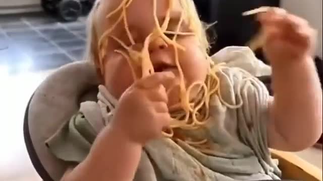 Baby Trying To Eat Noodles In One Bite