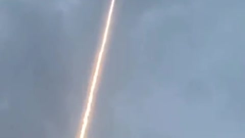 Lightning bolt is guided to ground through rocket trail