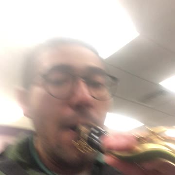 Making elk calls on a saxophone